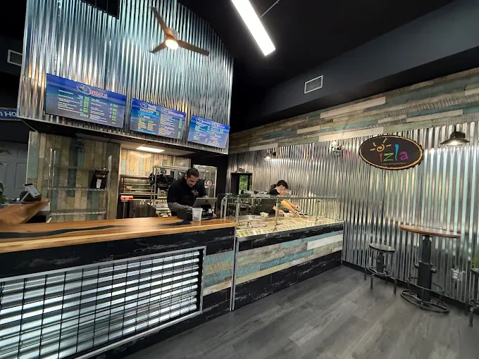Order counter and kitchen inside Izla Puerto Rican restaurant in Mohegan Lake, NY