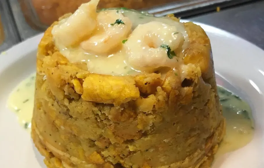 Izla mofongo topped with garlic shrimp
